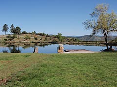 All Seasons Weed Control photo of manicured lawn by water