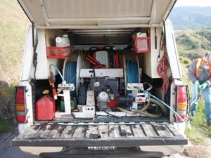 All Seasons Weed Control - truck in the field for invasive weed control